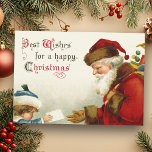 Vintage Santa and Child med jul Brev Julkort<br><div class="desc">Nostalgisk bild av Viktorians röda Jultomten-bärväska från Viktorian-eran från leksak som får ett brev från ett blint barn i blått jacka och hatt. Kompletterande bild vid omvänd text med anpassade.</div>