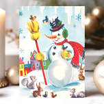 Vintage Snögubbe med djurets jul Helgkort<br><div class="desc">Fira julhelgen med detta charmerande årskort med ett glatt snögubbe omgivet av vackra djur. I den vita scenen finns fåglar, ekorrar och kaniner, alla mot en färglös bybakgrund. Det här nostalgiska helgdag fångar magin och oskuld från en klassisk jul, perfekt för att skicka varmt önskemål till vänner och familj. Anpassa...</div>