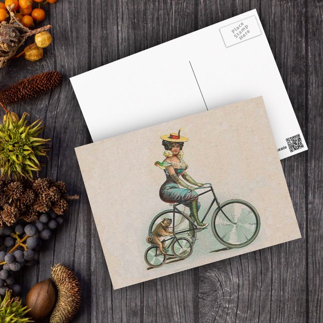 Vintage Victorian Dam Hund Bicycle Vykort (Victorian lady riding a bicycle beside her bulldog riding a bicycle on a tan postcard.)