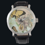 Vintage vykort med fjäll och blommor armbandsur<br><div class="desc">Den här utskriften av ett vykort för vintage med lavender-blommor och färgstarka fjärilar skapades av Vision Studio. Ett underbart biet som skulle fantastisk på vilken mur som helst. Beställ idag!</div>