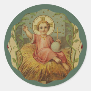 Vintagebaby Jesus i en Manger Runt Klistermärke