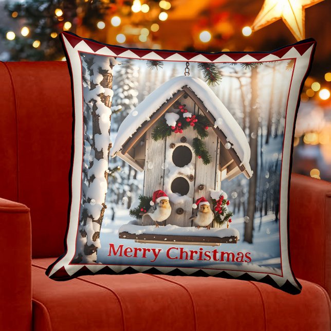 Vinterfågelhusets julkonst kudde (Christmas pillow featuring a cute painting of a winter bird house in a snow covered forest)