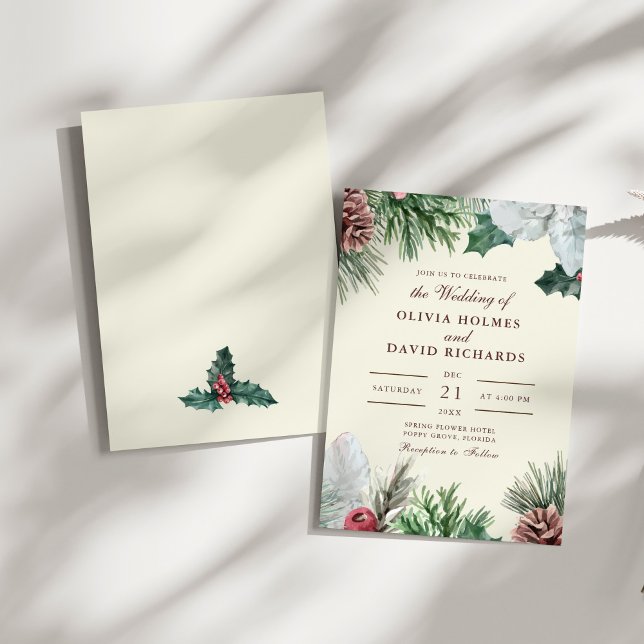 Vintergrön bröllopsinbjudan inbjudningar (Winter Greenery Wedding Invitation on a sunny white table.)