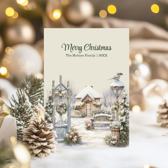 Vinterjullkort Grind - vinterstuktur Julkort (Winter Gate Christmas Card – Snowy Cottage Scene on a table with Christmas decor and lights.)