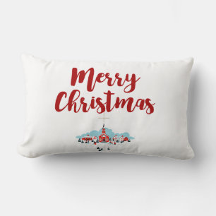 Vinterscen med en röd kyrka och julstjärna lumbarkudde