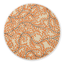 Virvlande orange blad på beige bakgrund knopp