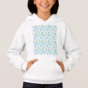 vit bakgrund med blåa blommor och grönt t shirt