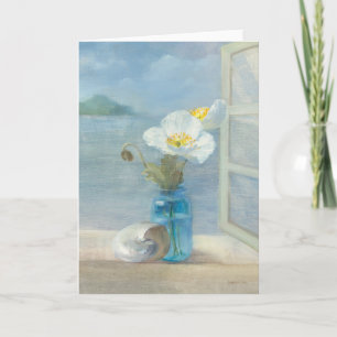 Vit blomma som förbiser havet kort