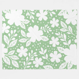 Vit blomsterdesign på mjuk grön bakgrund fleecefilt