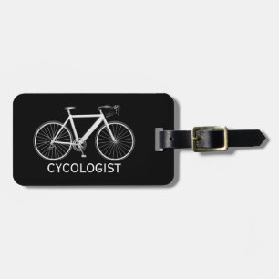 Vit cykel på svart bagagebricka