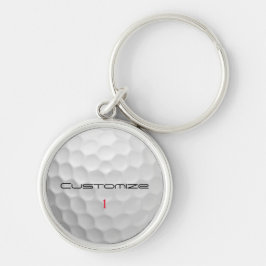 Vit golfboll med gropig textur och anpassat namn o rund silverfärgad nyckelring