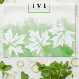 Vit kapsel grönt i löv tvättar, monogram kökshandduk