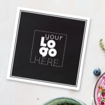 vit logotyp på svarta pappra party-blöjor