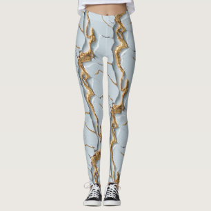 Vit marmorstruktur med sprickiga guldådror leggings