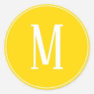 Vit monogram på rund guldegel klistermärke
