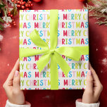 Vit Multifärgad för Festive God jul Presentpapper<br><div class="desc">Sprid helgdag jublar med detta papper som innehåller en utformning av God jul för festligt bruk. Den upprepade God jul-texten i pulserande flerfärgad typsnitt som rosa, blått, grönt, gult och rött på vit bakgrund skapar ett glatt utseende. Perfekt för julentusiaster tittar att figurera gåvor med en ljus och högstämd beröring....</div>