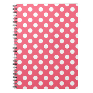 Vit polka dots på korall anteckningsbok med spiral