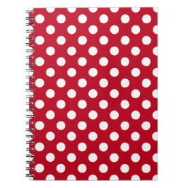 Vit polka dots på rött anteckningsbok med spiral