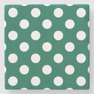 Vit polka dots på sädesvätska grönt stenunderlägg