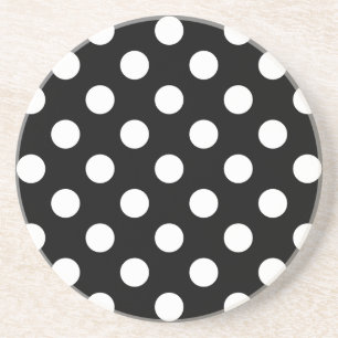 Vit polka dots på svart underlägg