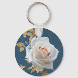 Vit ros och guld löv i blå botten nyckelring