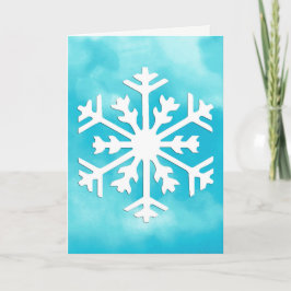Vit snöflinga på blå akrylfärg bakgrund helgkort