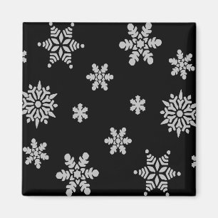 Vit snöflingor med svart bakgrund magnet