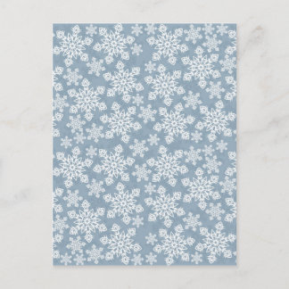 vit snöflingor på blå vykort