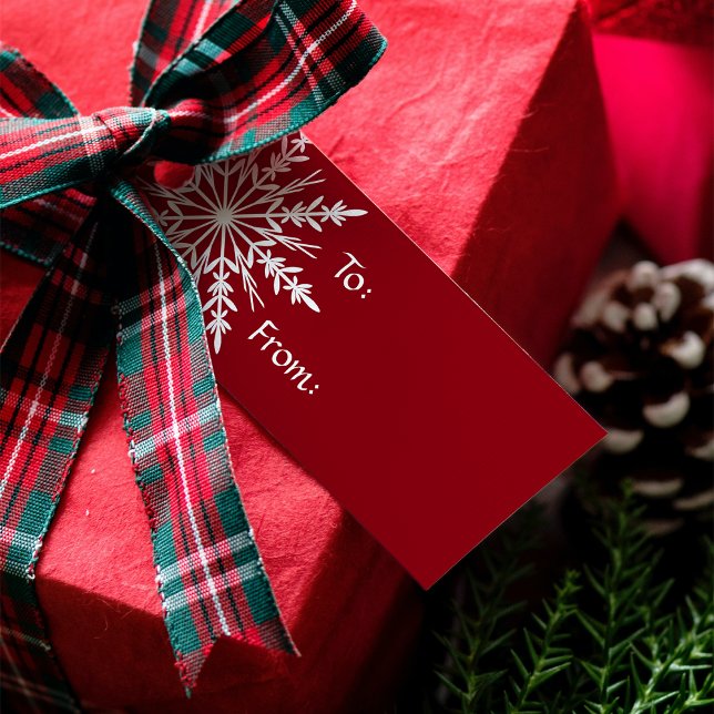 Vit snöflingor på Röda julen Helgdag Presentetikett (Skapare uppladdad)