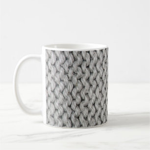 Vit stickad ull struktur, närbild. kaffemugg