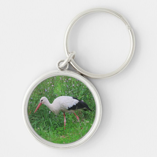 Vit stork rund silverfärgad nyckelring (Framsidan)