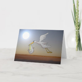 Vit stork som flyger nattetid himmel och fullt mån kort