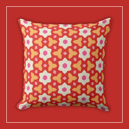 Vita blommor på röd och persikofärgad geometrisk B Kudde