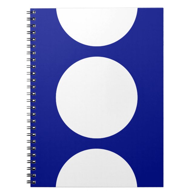 Vita cirklar på blå anteckningsbok med spiral (Framsidan)