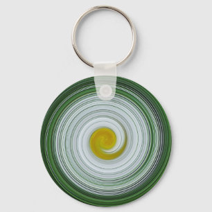 Vita, gult, grönt spiral mönster nyckelring