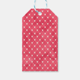 Vita hjärtan på röd bakgrund presentetikett