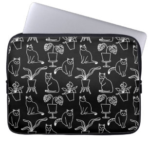 Vita katter i svart laptop fodral