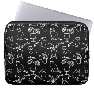 Vita katter i svart laptop fodral
