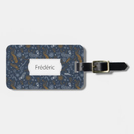 Vita och gyllene blommigtar i blått bagagebricka