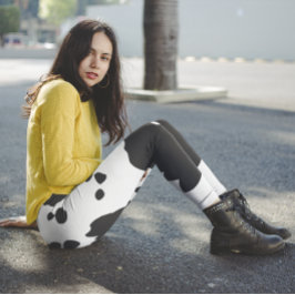 Vita och svarta ko-prickar leggings