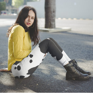 Vita och svarta ko-prickar leggings