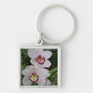 Vita orchids vackra tropiska blommor fyrkantig silverfärgad nyckelring