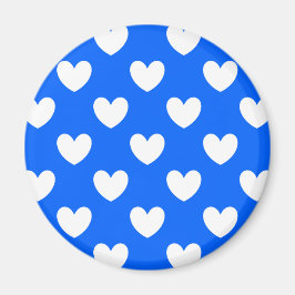 Vita polka-hjärtan på blått magnet