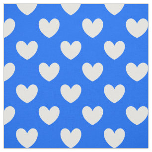 Vita polka-hjärtan på blått tyg