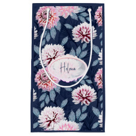 Vita, rosa blommor på mörk blått.