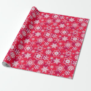 Vita snöflingor med röd bakgrund presentpapper