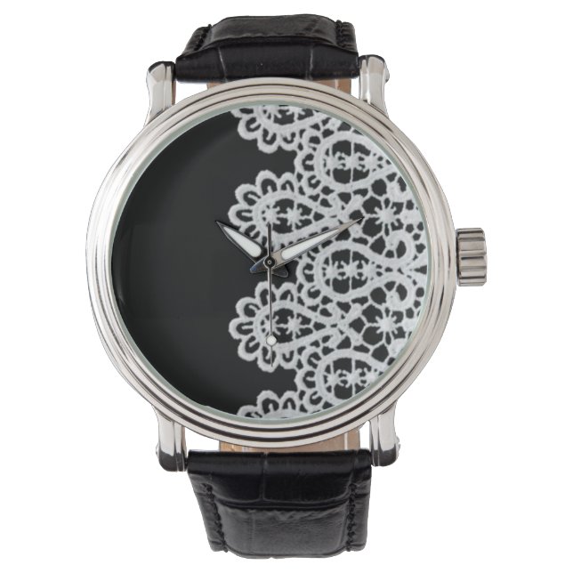 Vita snöre utgör ett känsligt gräns mot svart armbandsur (Framsida)