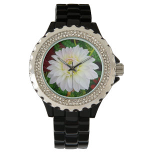 Vitblomma och rosa armbandsur