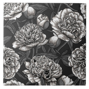 Vitblommor på mörk grått kakelplatta