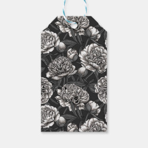Vitblommor på mörk grått presentetikett